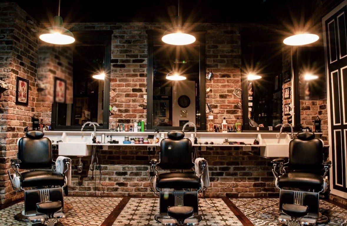 Barber chairs under warm lights