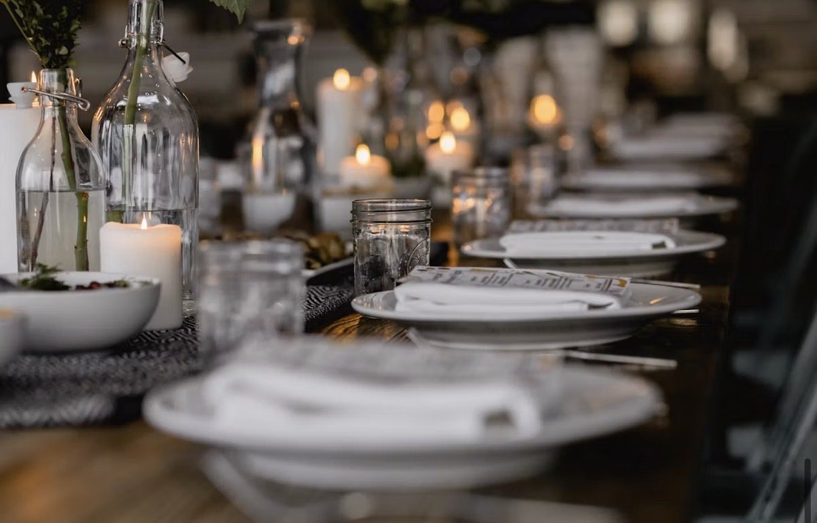 A long table set with candles